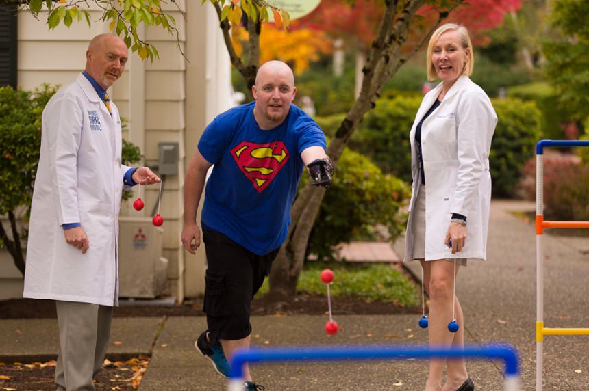 Patient playing fun games outdoors with therapist Kerstin Baun and Dan Conyers, National Clinical Director