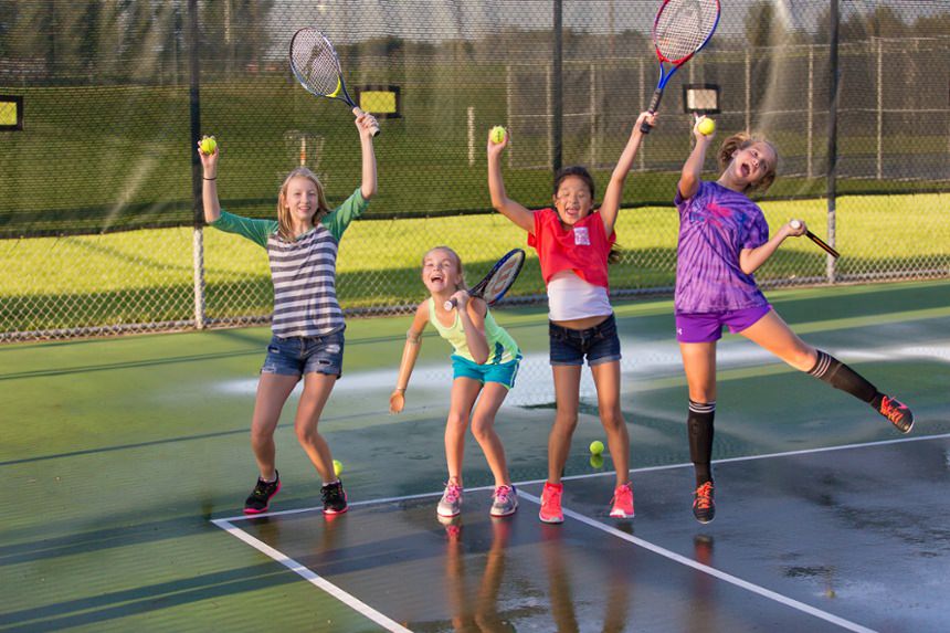 Amber plays tennis with her friends with the assist of her activity-specific prosthesis
