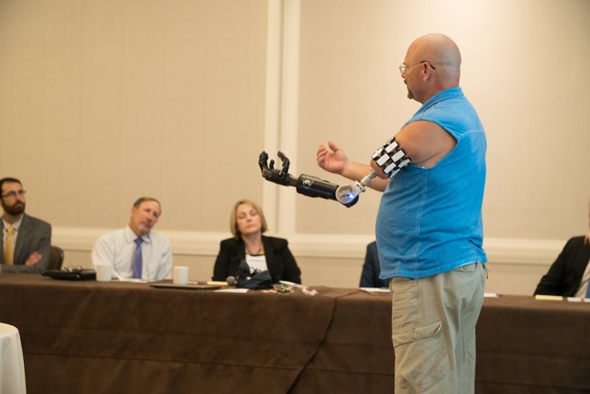 Osseointegration patient presenting at Arm Dynamics' upper limb prosthetic symposium