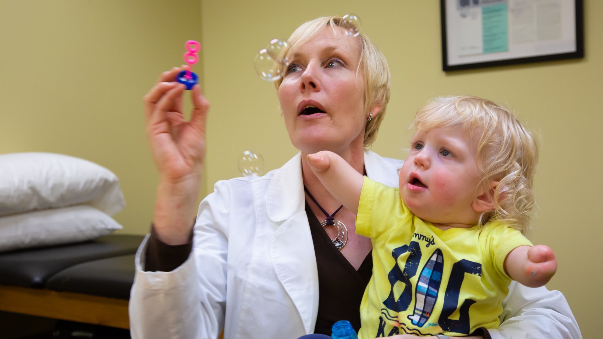 A clinical therapy specialist works with a pediatric patient