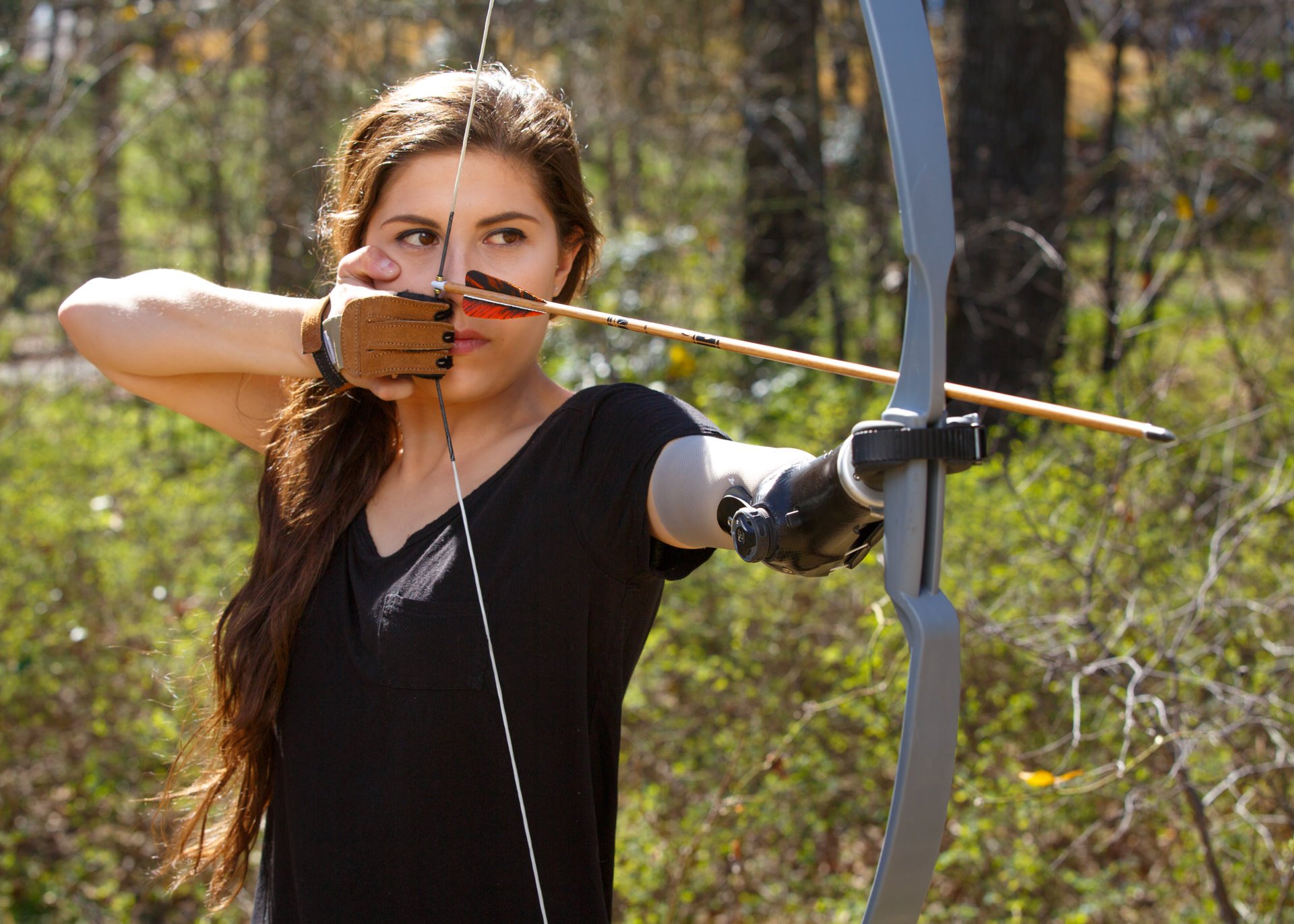 Angel Giuffria uses her activity-specific prosthesis to practice archery.