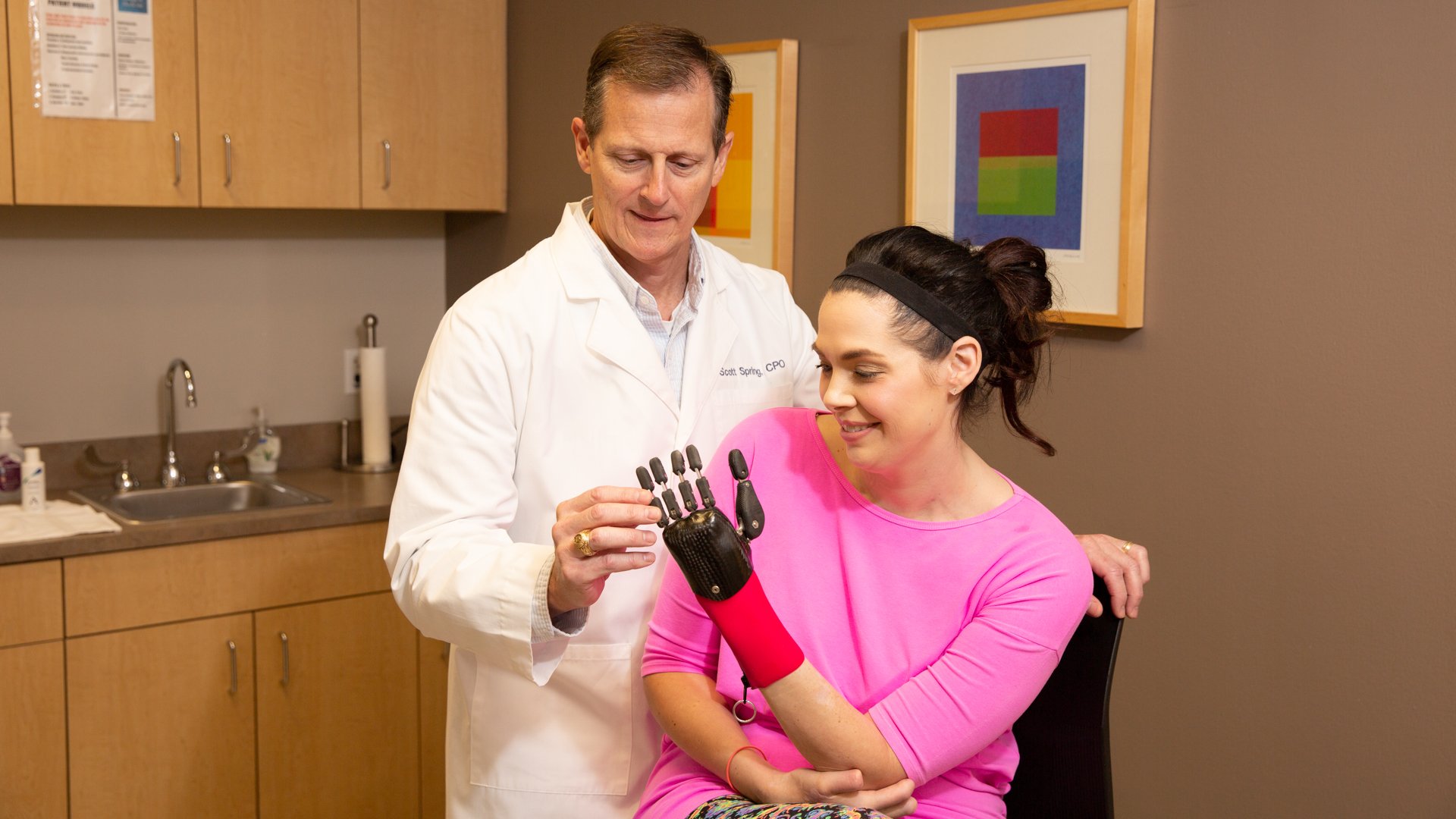 Scott Spring, prosthetist, works with partial hand patient with custom silicone passive prosthesis