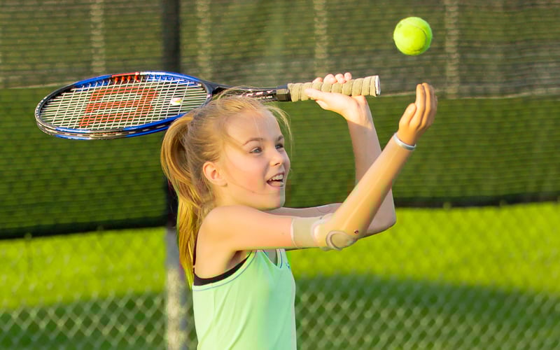 Amber Peterson playing tennis in Minnesota