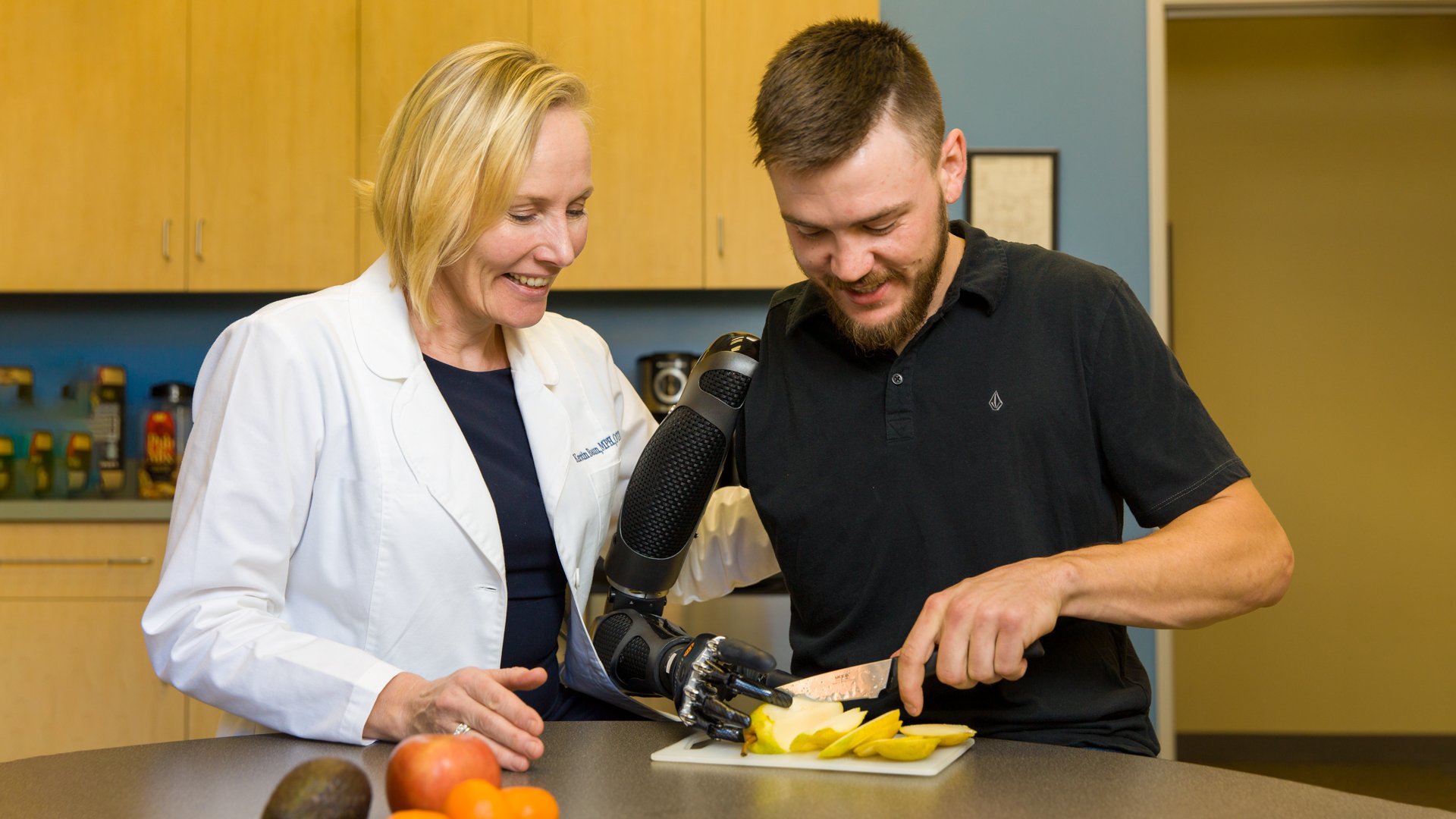 Clinical therapy specialist working with a shoulder level patient