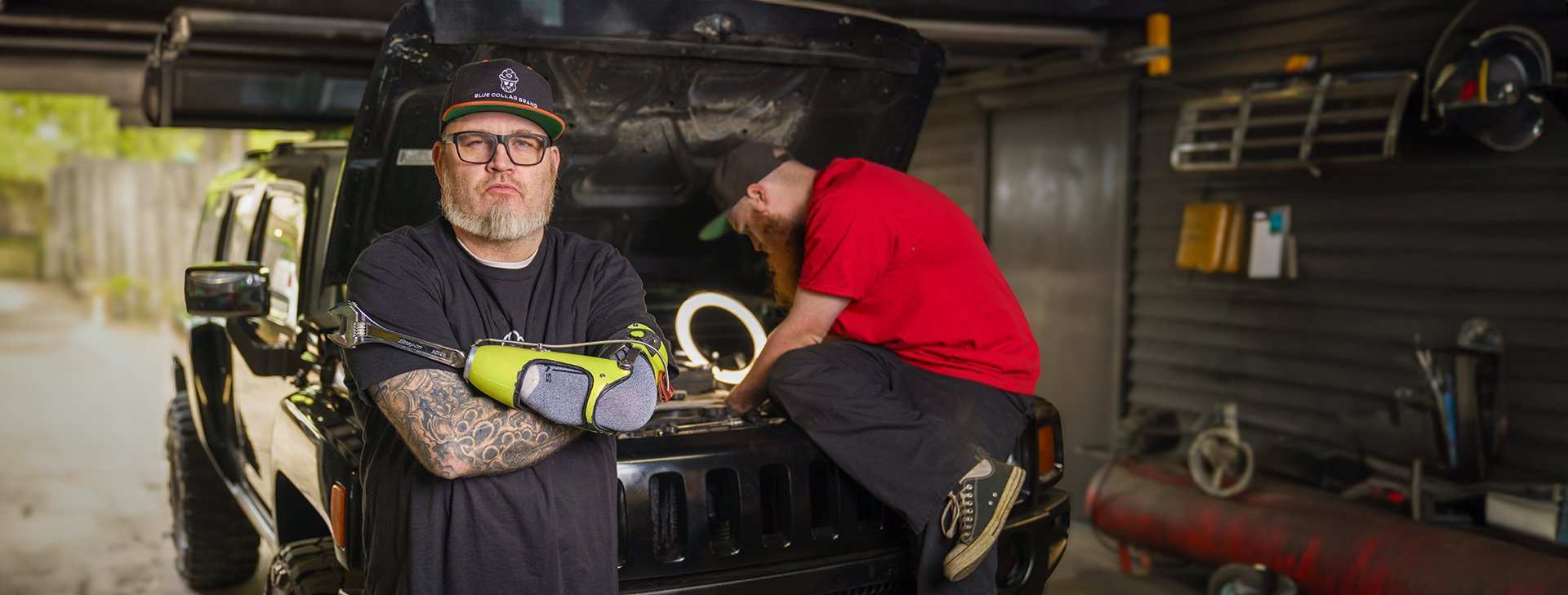 Abe Baker working with son, Seth on a car