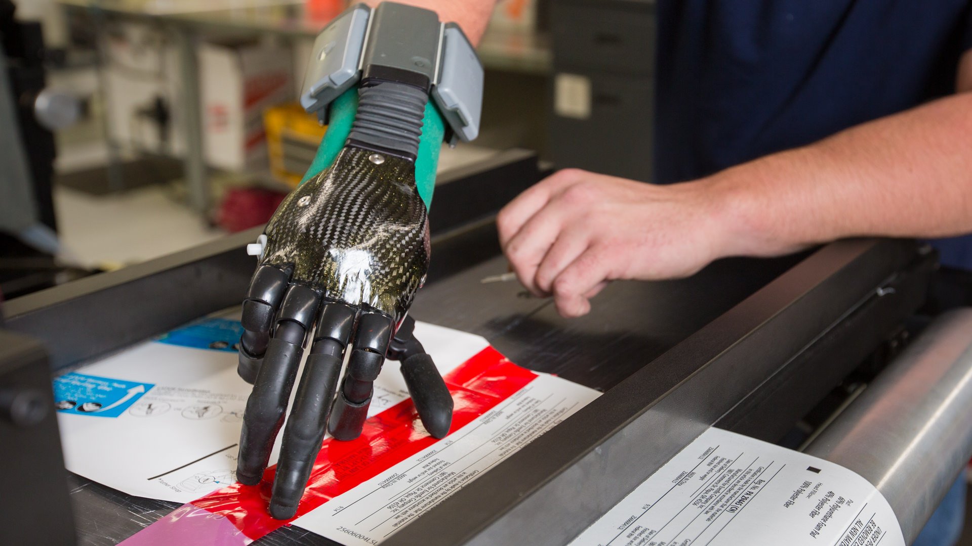 Alex uses electrically-powered idigts for work at a printing company