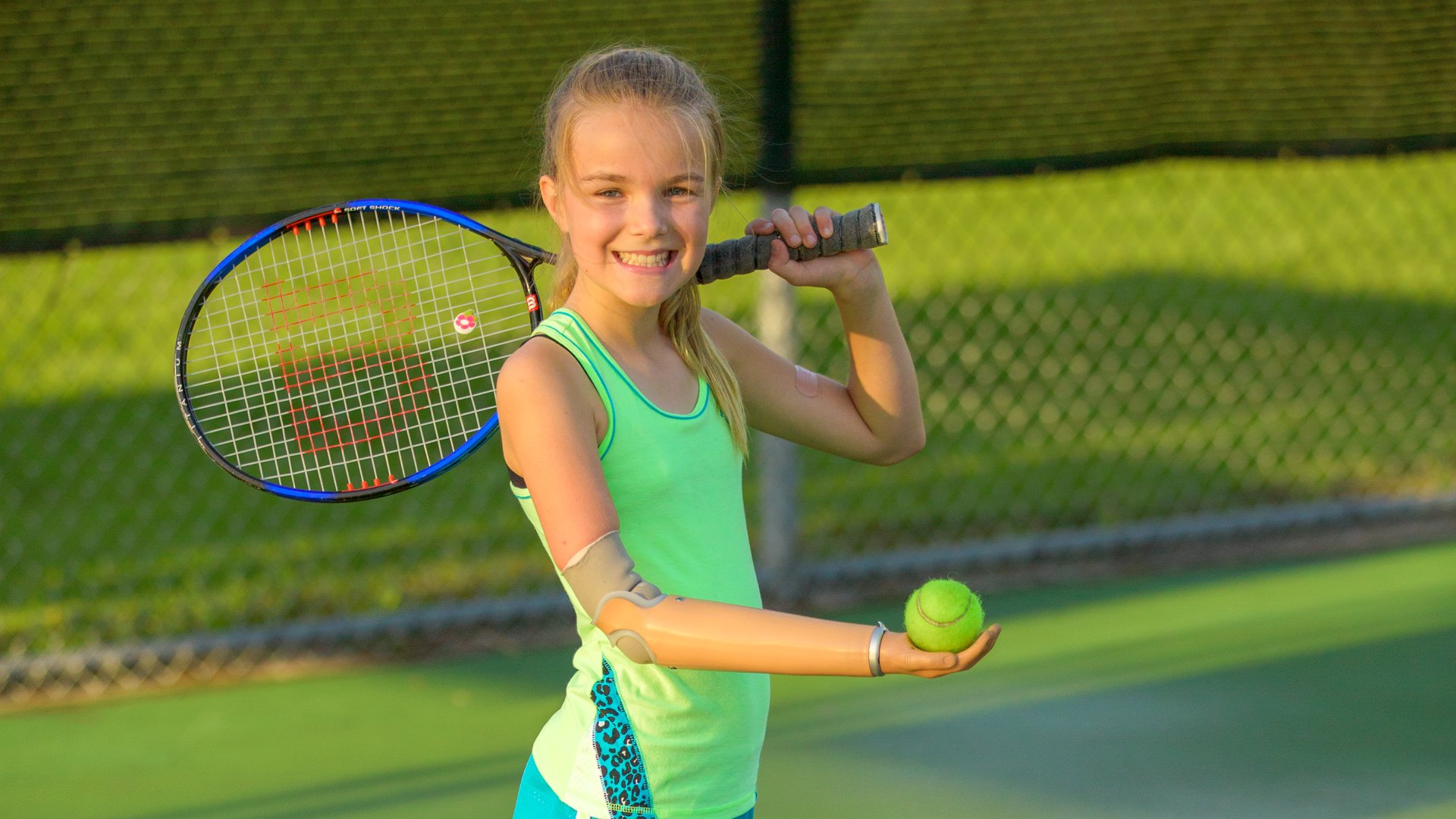 Amber uses her Sporty hand in Tennis practice at school