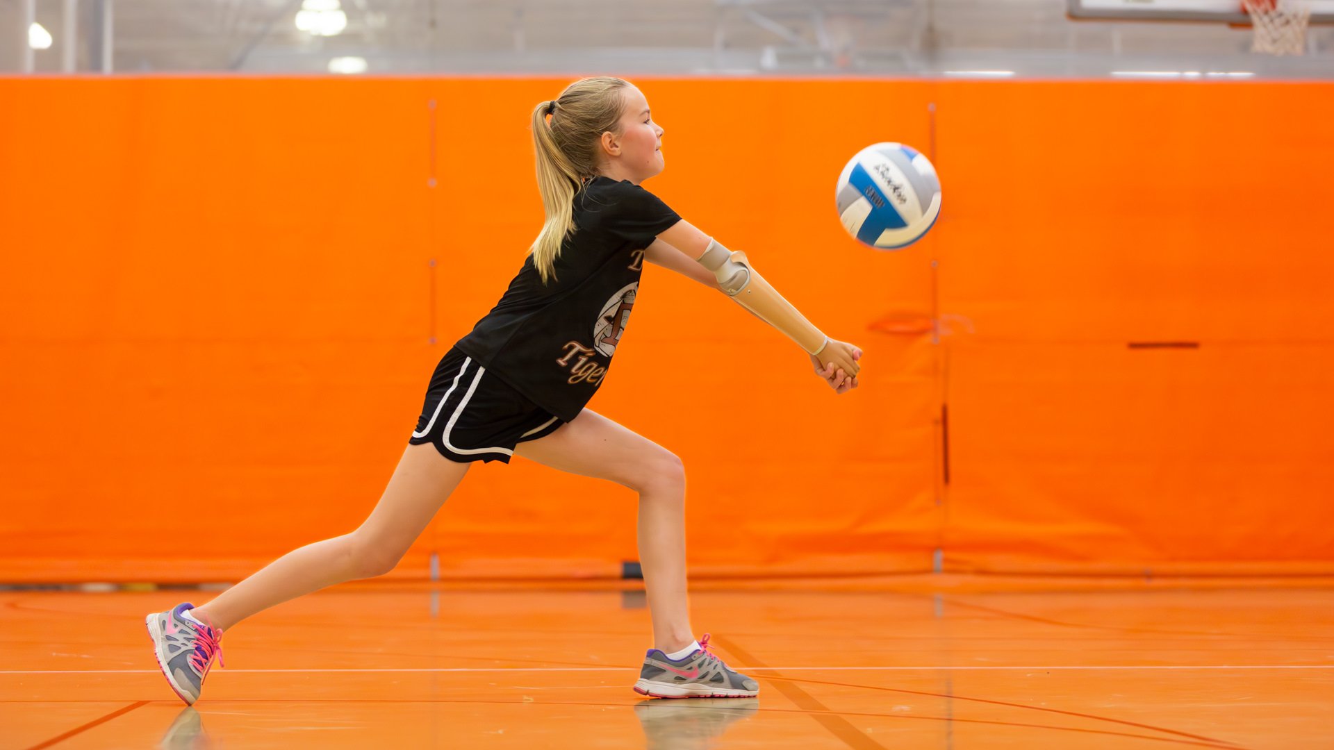 Amber uses her sporty prosthesis to play vollyball