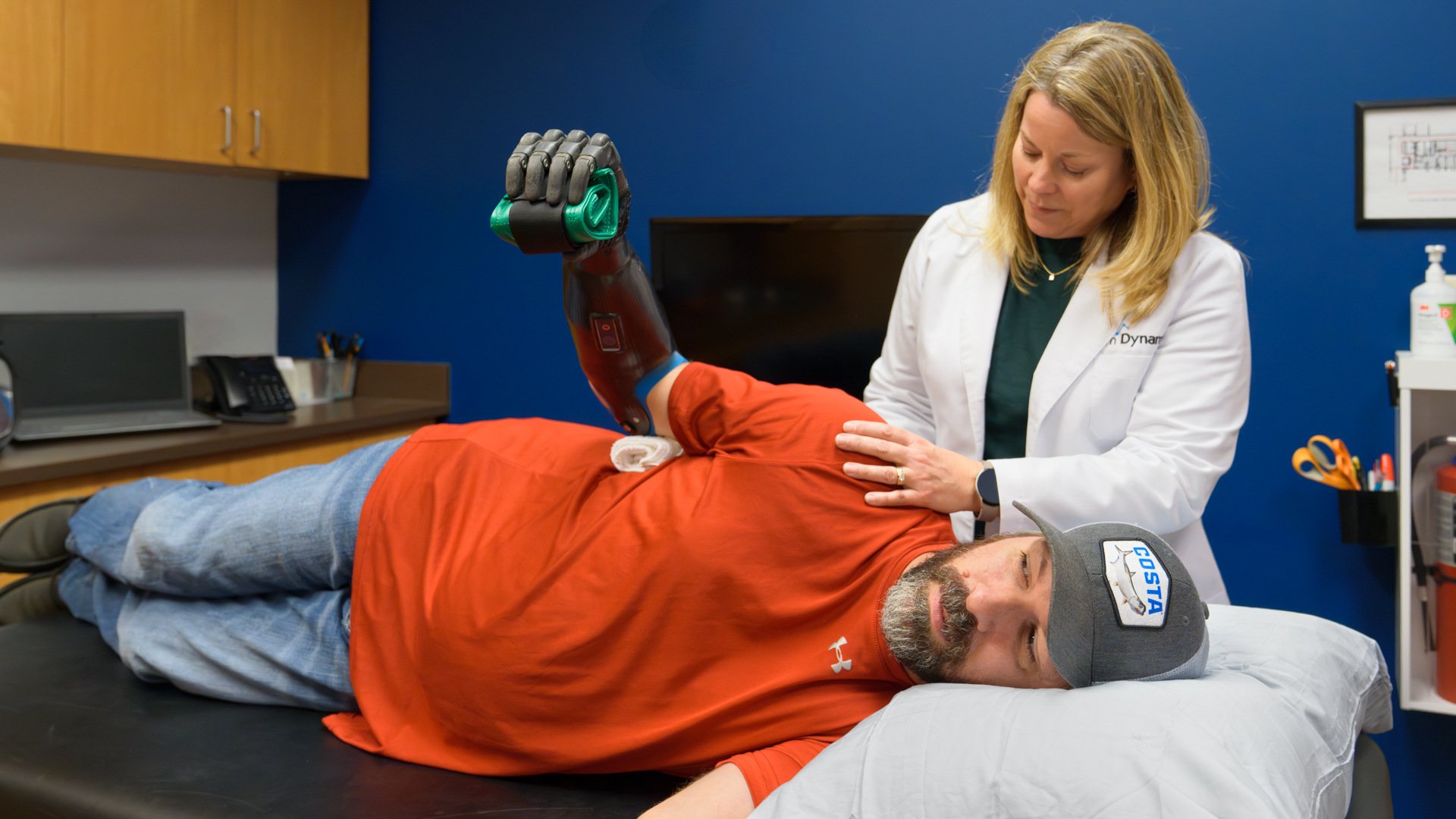 Clinical Therapy Specialist Becky Park works with a transradial patient on muscle recovery