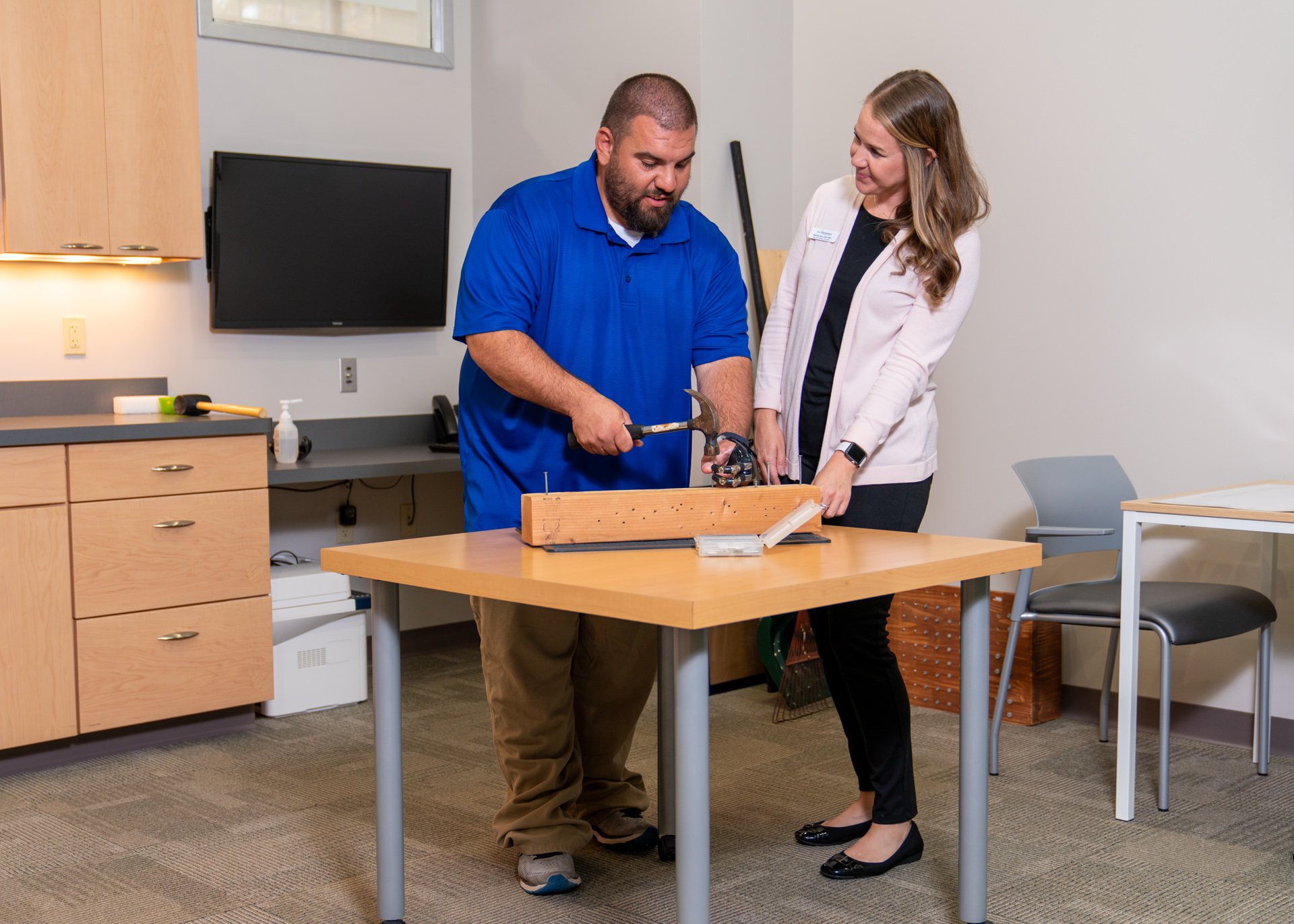 Clinical Therapy Specialist works with Partial Hand Patient