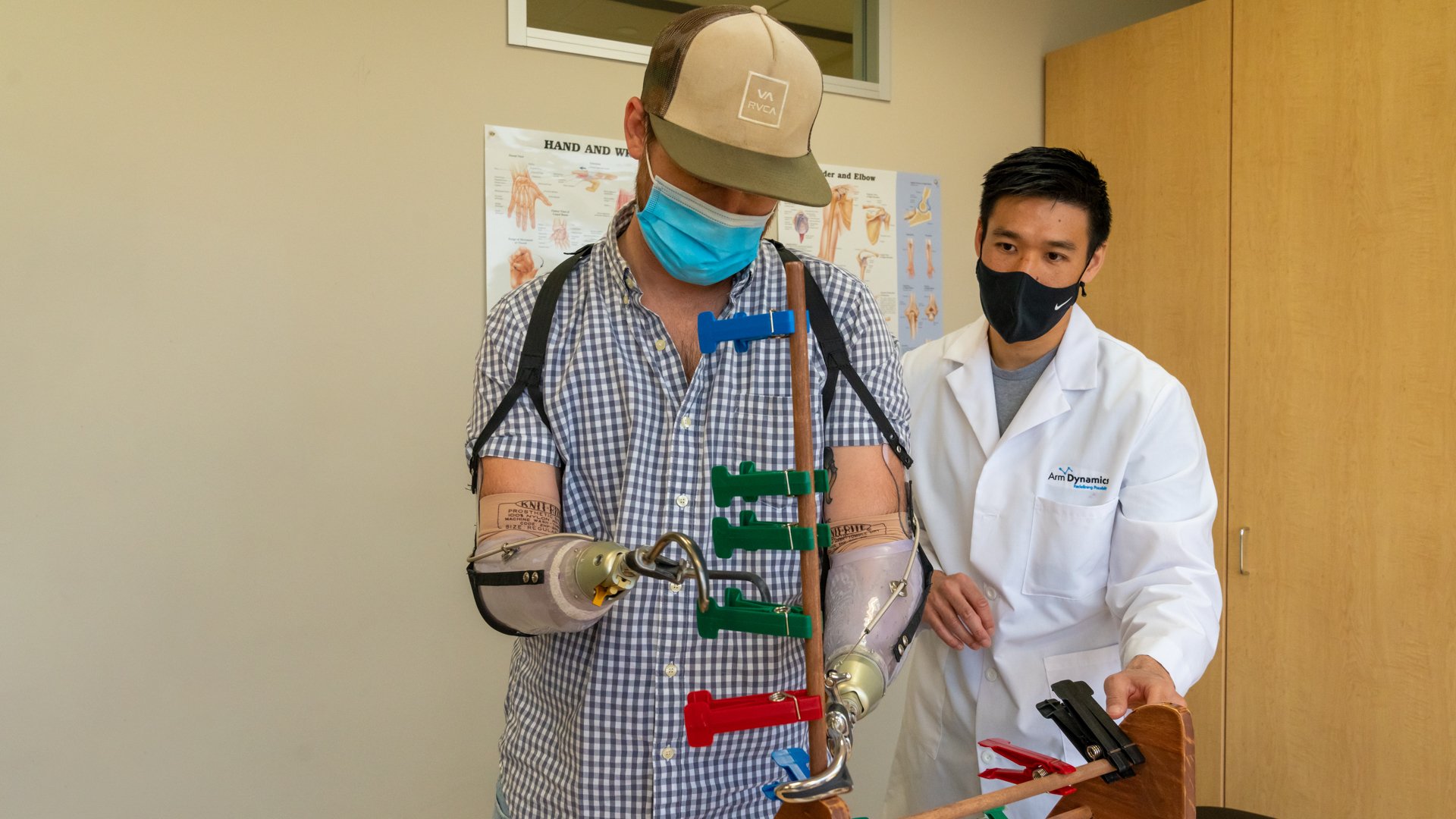 Arm Dynamics clinical therapy specialist working with a bilateral, transradial patient
