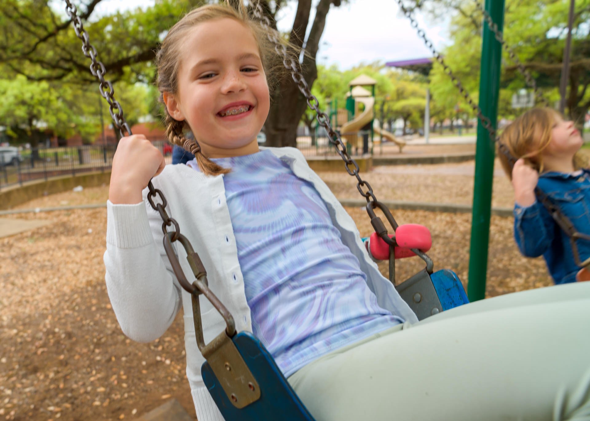 Congenital pediatric patient Autumn Egnatuk uses her activity-specific prosthesis on the playground.