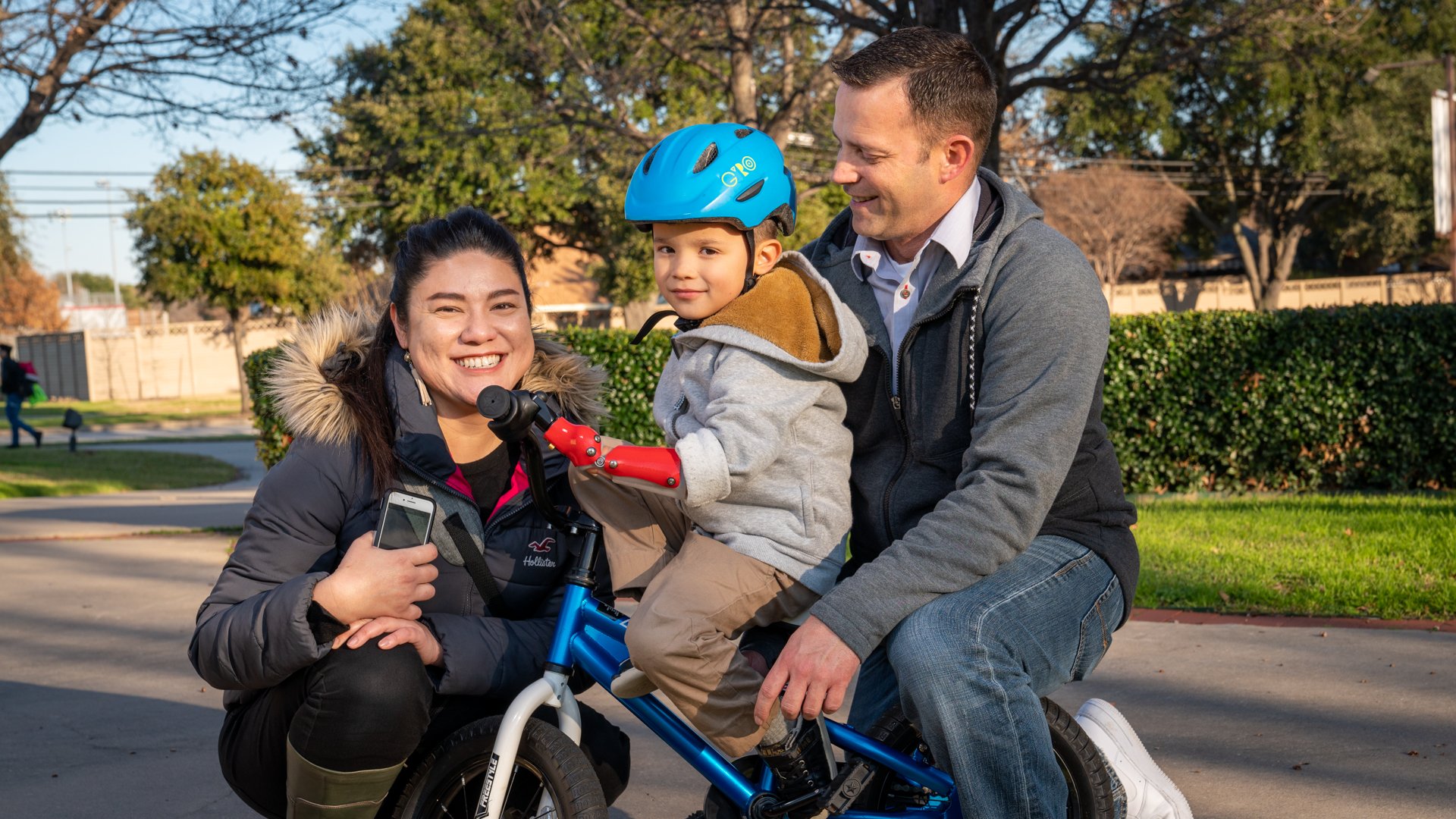 Pediatric patient with his new activity-specific bike prosthesis at the Dallas clinic