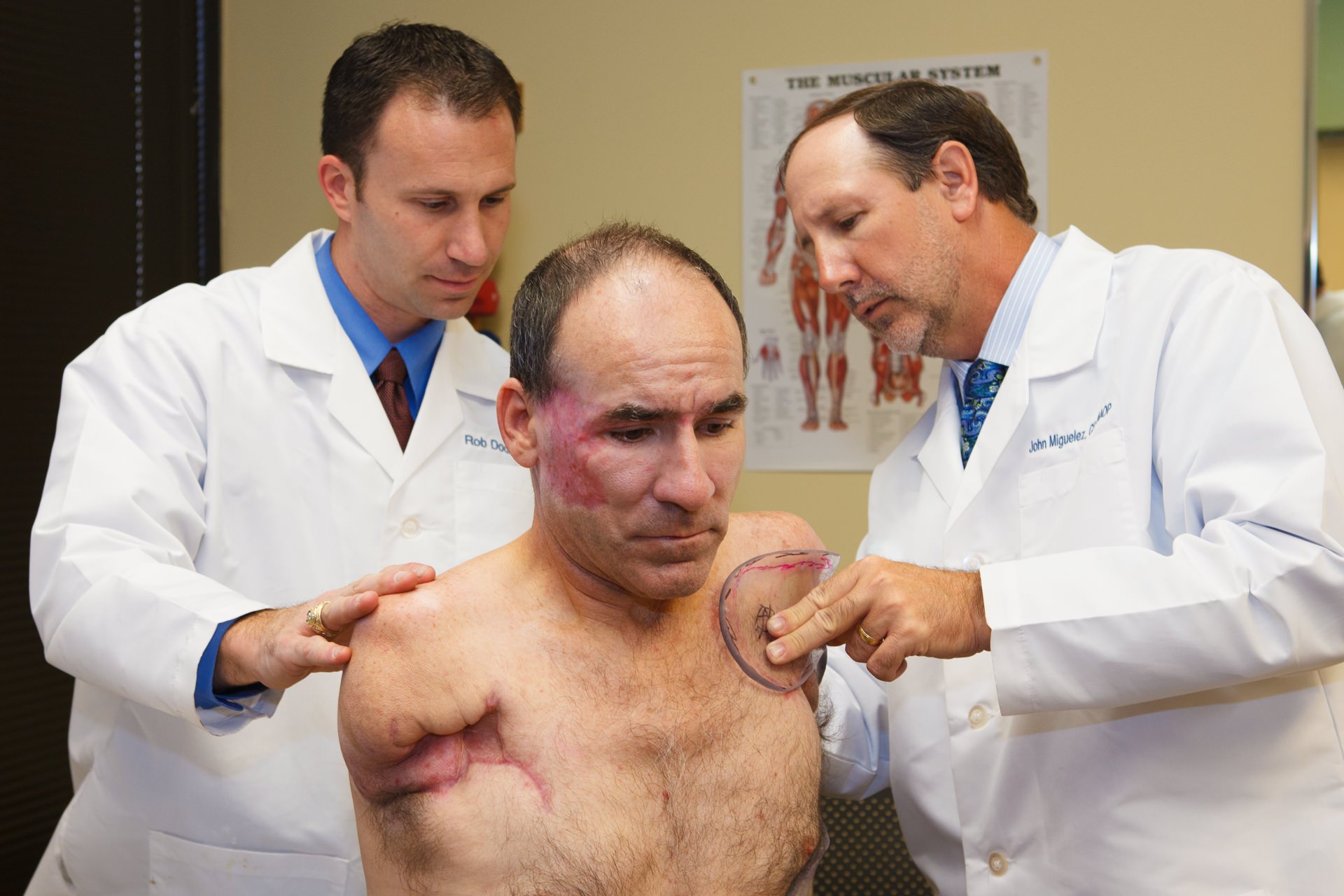 John Miguelez, CP, FAAOP(D) and Rob Dodson, CPO, FAAOP work with a high level patient