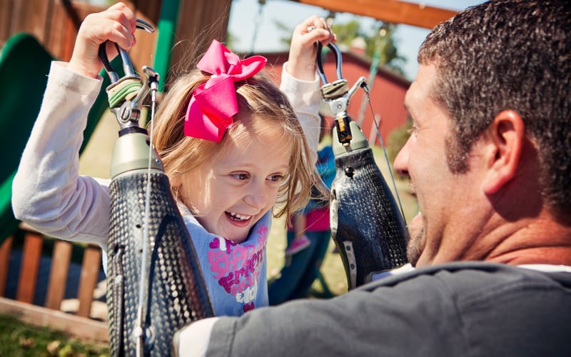 Southwest Center patient Jason Koger plays with his daughter at home