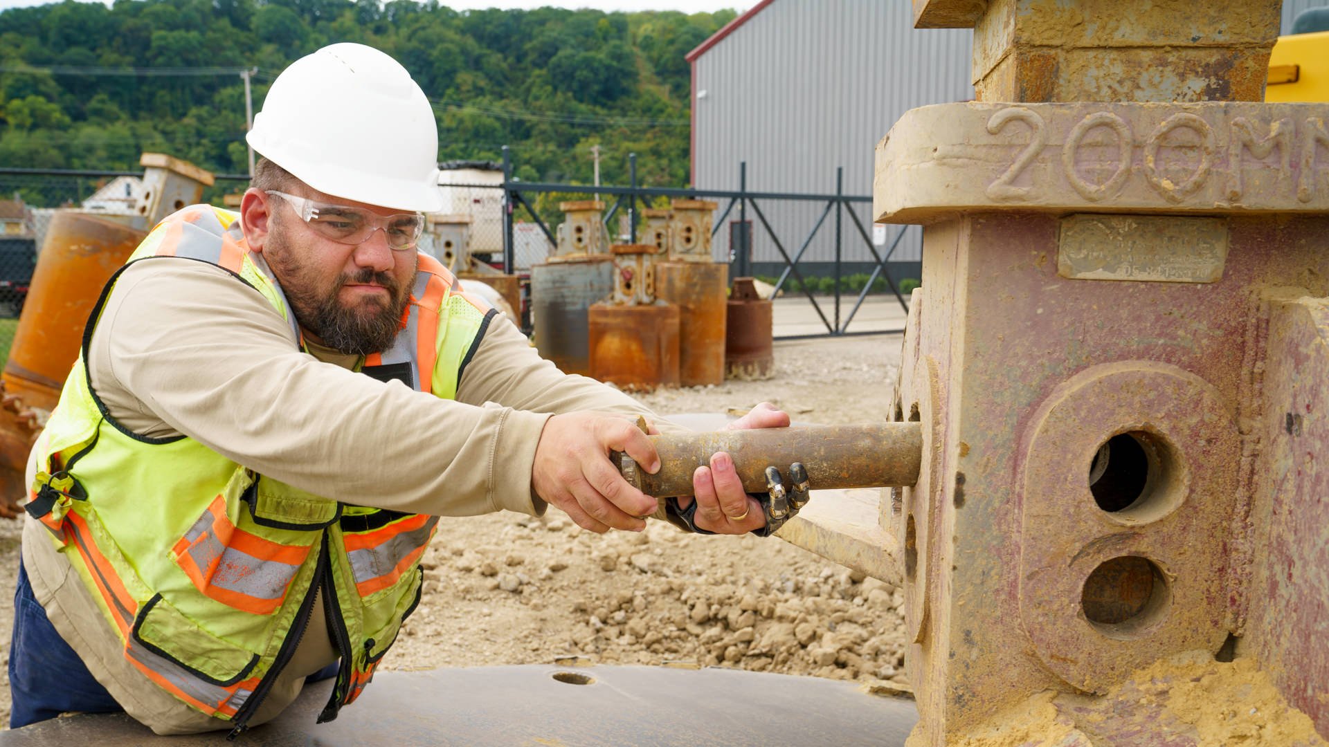 Mark Betters using his Point Design Digits to change out a huge drill bit.