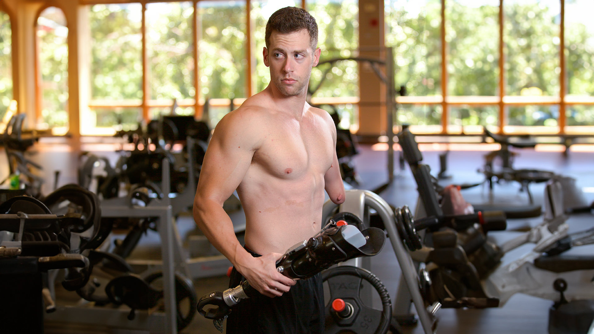 Max Okun getting ready to don his prosthesis for a workout-1