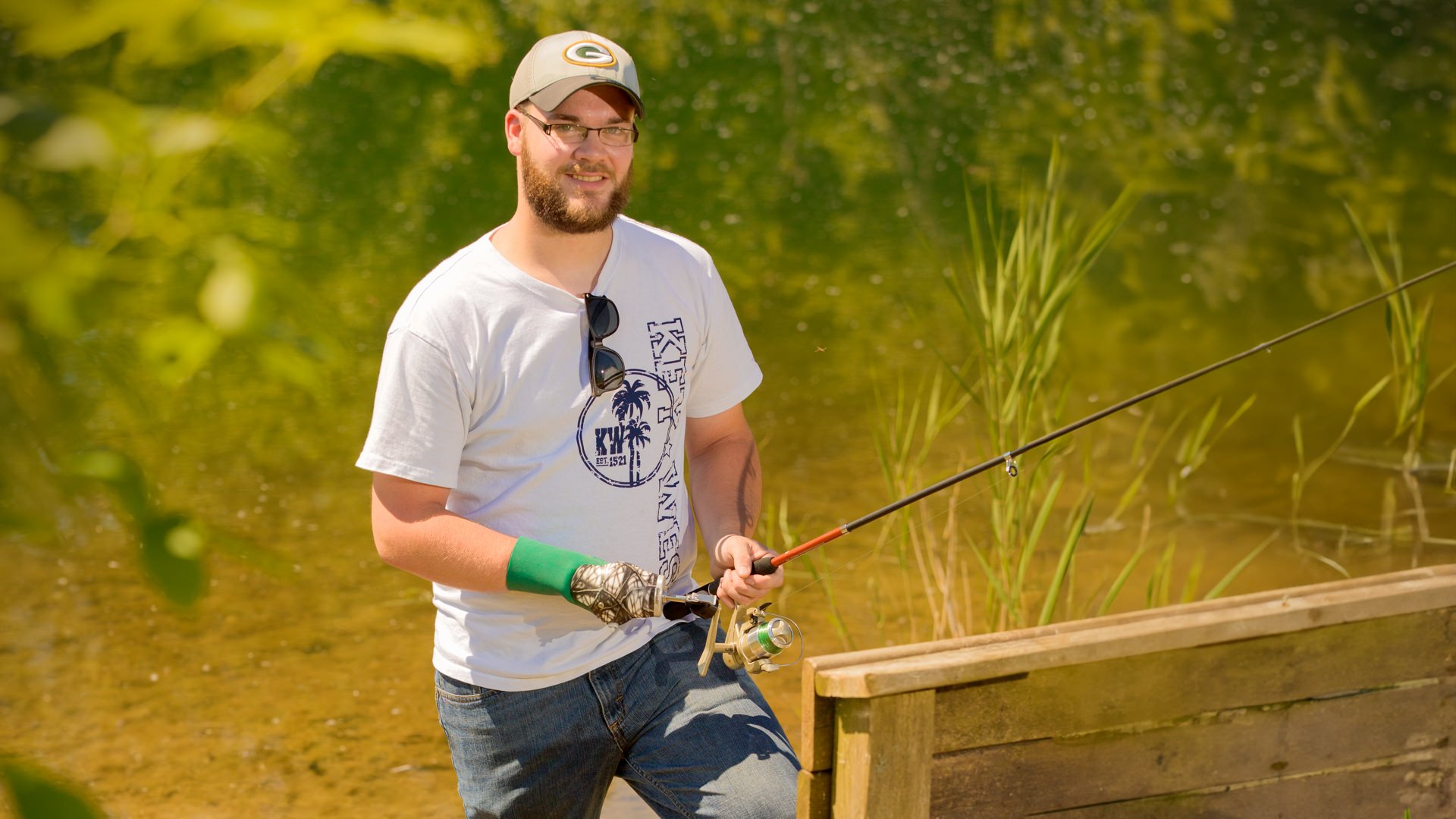Minneapolis Patient, Alex Krueger enjoys fishing with his activity-specific fishing device