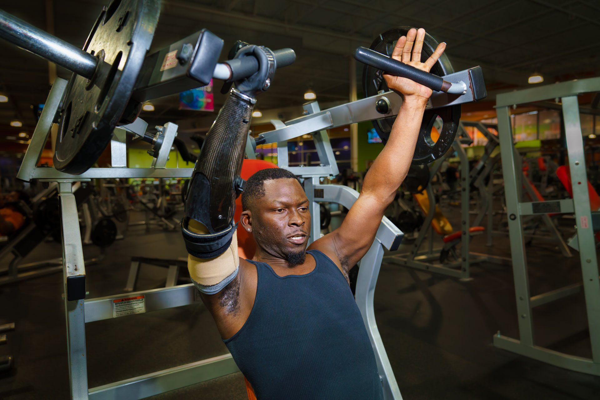 Xavier Collier at the gym with his activity-specific workout prosthesis