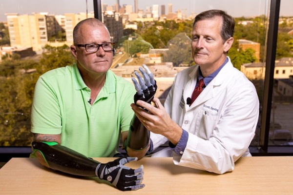 Arm Dynamics patient working with his myoelectric hand prostheses