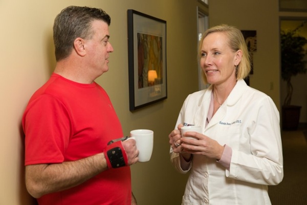 Arm Dynamics patient using his multi-positional joints prosthesis to hold a cup of cofee